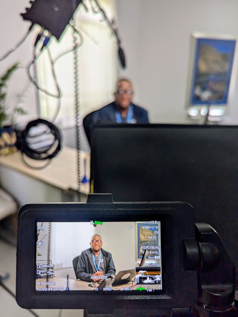 Camera monitor framing an on-set interview shoot